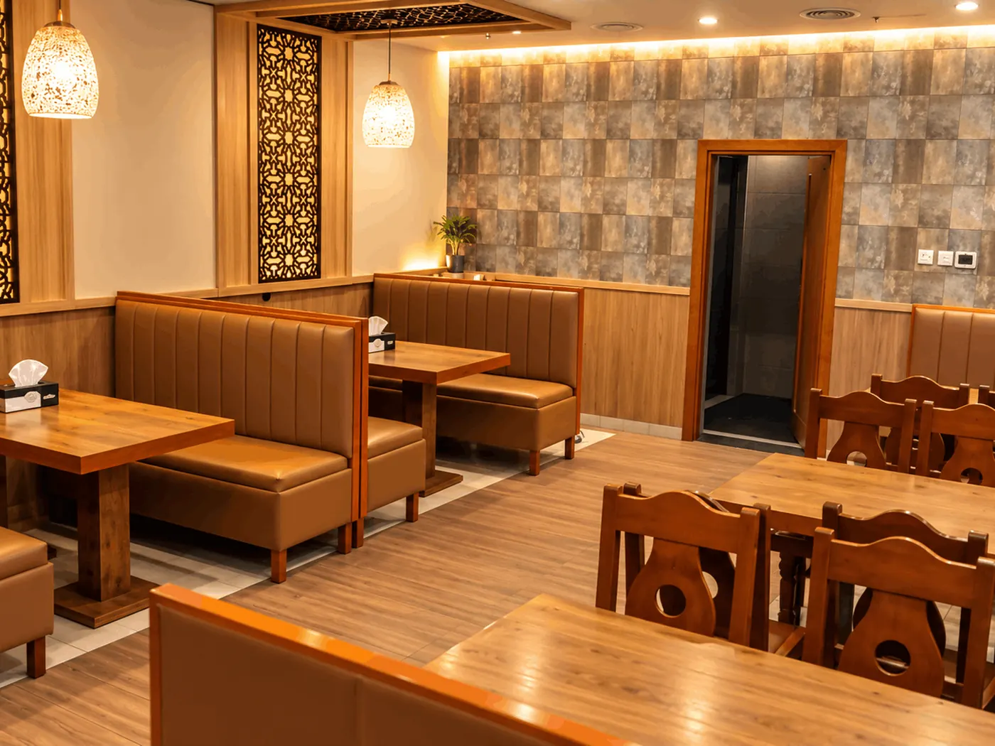 Warm-lit booth seating along the wall of the King Chef dining room